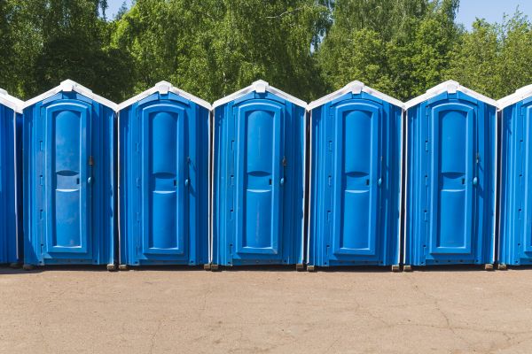 Festival porta potty rentals lined up at an outdoor event in Douglasville Ga