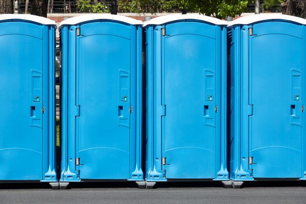 Porta potty delivery truck dropping off rental units in Athens Ga